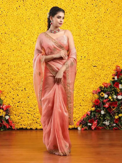 The graceful drape of the organza fabric is captured in this beautiful shot, perfect for a wedding guest or bridesmaid.