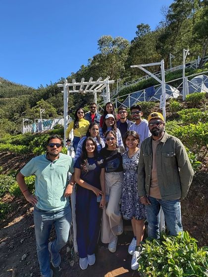Our group on the steps of our terraced campsite, surrounded by the lush greenery of the tea plantation.