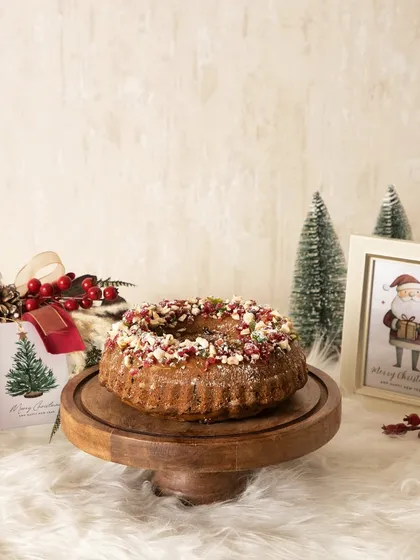 Another look at my traditional Christmas plum cake, beautifully presented on a wooden stand and ready to be the star of your holiday table.