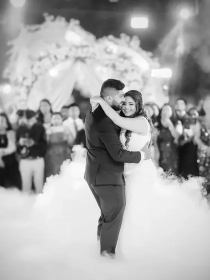 The first dance is pure magic. I capture the energy with dramatic lighting and a focus on the couple's connection, creating a timeless black and white photograph of the celebration.