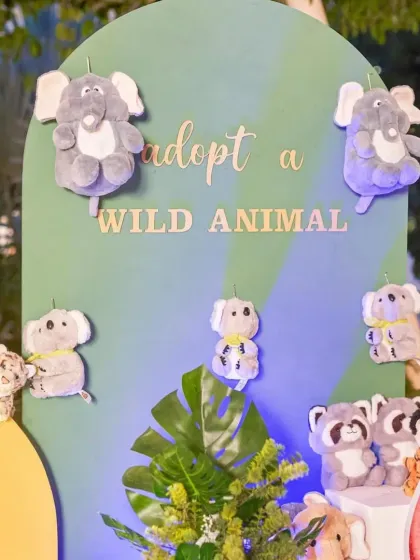 We love adding interactive elements to our parties. This 'Adopt a Wild Animal' station with cute plush toys was a huge hit with the kids as a party favor.