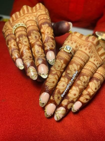 Here’s another stunning option for an engagement. The soft nude base is the perfect canvas for these sculpted gold accents and delicate gem placements, creating a look that is both traditional and modern.