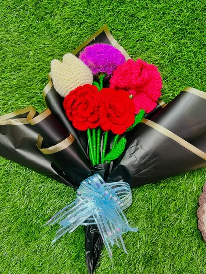 A beautiful handmade crochet bouquet, featuring a mix of vibrant flowers, professionally wrapped and ready for gifting. This is a perfect, lasting present for any occasion.