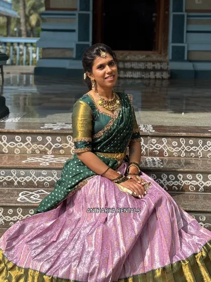 One of my happy clients looking radiant in a traditional silk Langa Voni. This green and lavender half saree is a beautiful choice for temple functions and cultural celebrations.