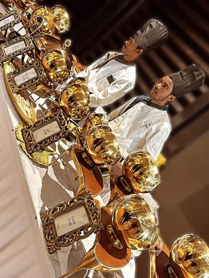A unique presentation concept using golden masks as part of the buffet decor, showcasing our flair for creative and memorable themes.