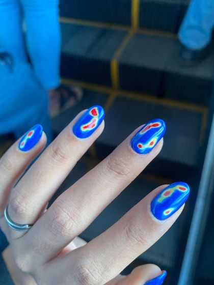 This thermal nail art is one of the most unique sets I've done. The design mimics a heat map for a super cool, futuristic look.