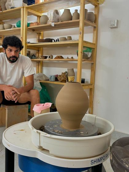 Pradyumna has been with us for just over a year, and he already creates with such passion. Here he is with one of his beautifully thrown forms, ready for the next stage of decoration.