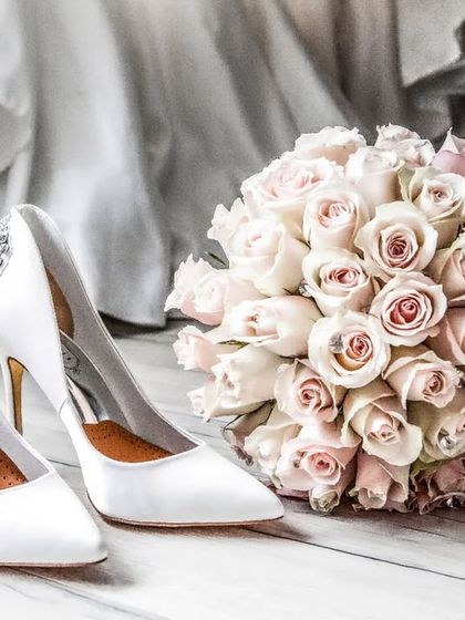 "Already feeling Wifey." A classic shot of the bridal essentials: elegant Ted Baker heels and a beautiful bouquet of roses, ready for the big day.