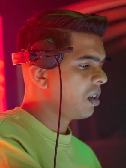 A close-up shot at Warehouse, locked in with my headphones on. I'm not just playing tracks, I'm telling a story.
