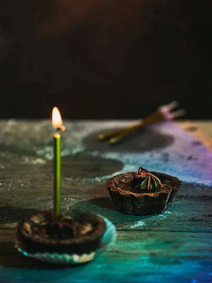 A similar composition of the lit tart, with slightly different lighting to show how minor changes can affect the mood.