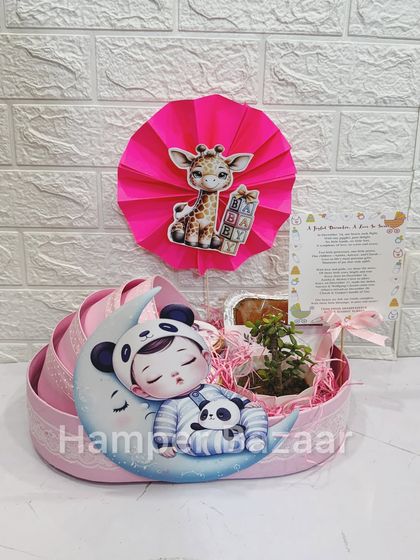 Our best-selling baby pram hampers are fully customizable. This pink version is perfect for a baby girl announcement or shower.
