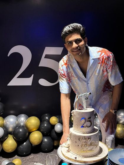 It was such an honour to make the cake for Shubman Gill's 25th birthday. Here he is with the finished two-tiered cake, topped with the hand-painted figurine.