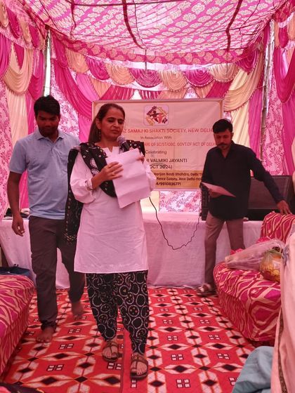 Preparing to take the stage at the community celebration. Even for smaller events, my team and I ensure everything is planned and organized, from the script to the sound system.