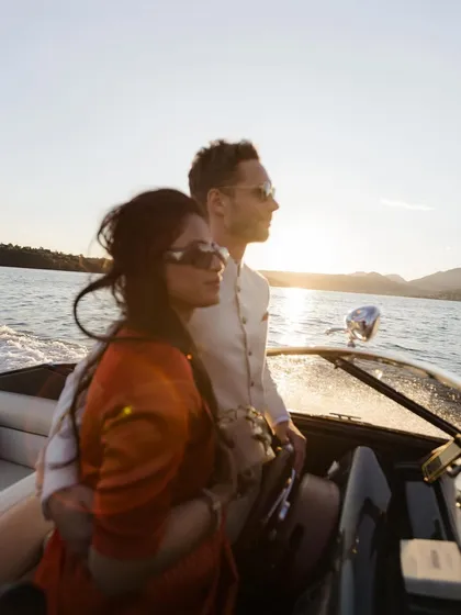 Sailing into the sunset on Lake Garda, Italy. This cross-cultural love story was captured with the golden light reflecting off the water, creating a truly cinematic and unforgettable pre-wedding memory.
