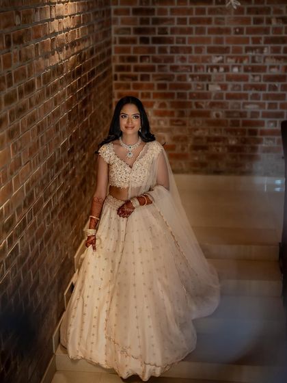 A final portrait on the stairs, capturing the full elegance of her look.