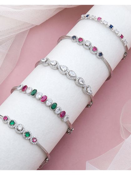 A stunning stack of our silver bracelets, showcasing a variety of designs with colourful gemstones. These eye-catching pieces are designed to dazzle and let your wrist do the talking.