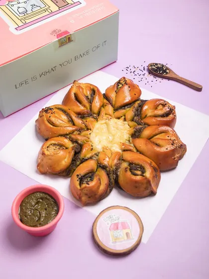 For a savoury option, I make this Pesto Cheese Snowflake bread. It's filled with my homemade pesto and lots of cheese, making it a fantastic party appetizer.