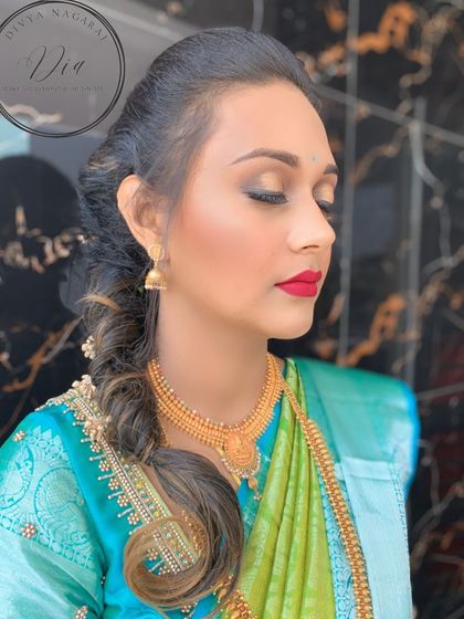 A side profile showing the details of this engagement makeup. You can see the subtle shimmer on the eyelids, the flawless blending, and the elegant side braid hairstyle.