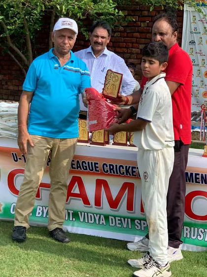 Celebrating the success of another young cricketer. Every trophy represents a step forward in their journey.