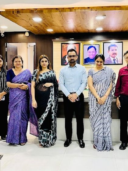 A group photograph with the esteemed faculty of a law college after a guest lecture. Collaborating with academic institutions helps bridge the gap between theory and practice.