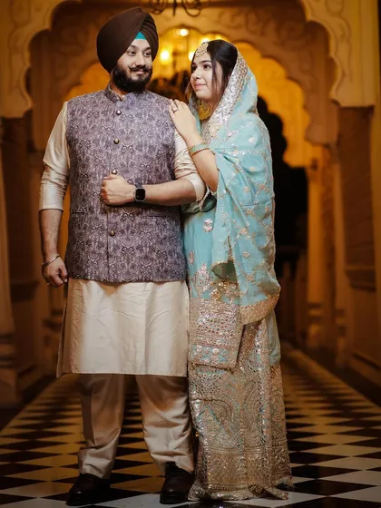 A classic pre-wedding portrait in a heritage location. The couple's traditional attire complements the elegant architecture.