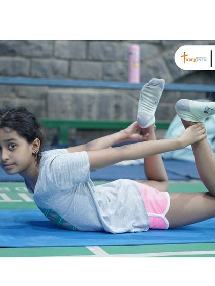 A young trainee practicing a yoga pose. I believe in introducing holistic fitness practices to children from a young age.