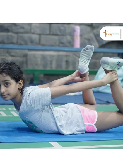 A young trainee practicing a yoga pose. I believe in introducing holistic fitness practices to children from a young age.