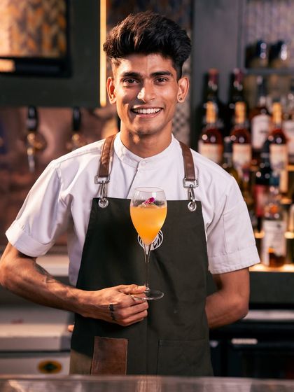 Bards tell tales of a drink so bold that the entire Silk Route glimmered when it was crafted. My marigold cocktail blends spiced marigold, grapefruit, passionfruit, honey, and rum. Tropical adventures spill out of this cocktail made for the ages.