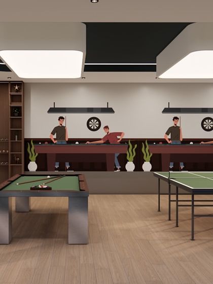 The indoor games room at the Shilpa Rathna Clubhouse is a vibrant space for recreation. It includes areas for table tennis, pool, and foosball, with modern lighting and durable finishes designed for active use.