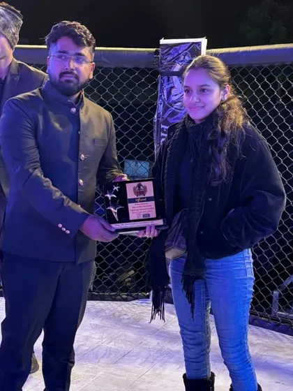 Our team members being recognized for their contribution as officials at the Elite Combat event.