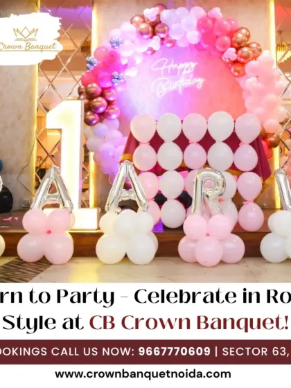 A "Born to Party" first birthday setup. The pink and white balloon decor, including balloon-based letters, creates a fun and festive atmosphere for a royal celebration.