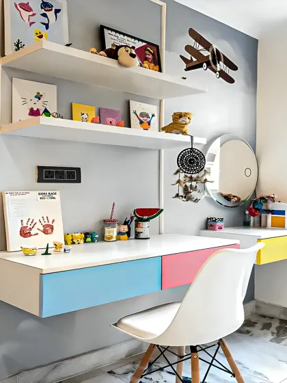 A bright and cheerful study corner for a child's room. The floating desk with colorful drawers and open shelving provides plenty of space for art supplies and books.