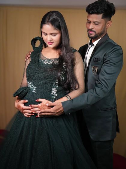 For a more modern maternity shoot, this father-to-be chose a dark green suit from our rental collection. It pairs beautifully with the mother-to-be's gown.
