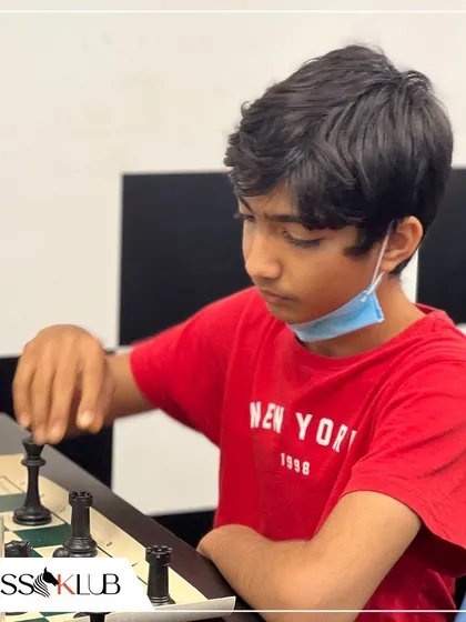 A young player contemplates his move during our Independence Day tournament. Themed events add an extra layer of fun and community spirit to our competitions.