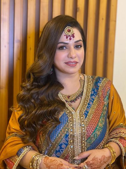 My beauty with classic Hollywood waves for a traditional event. This timeless hairstyle adds a touch of old-world glamour.