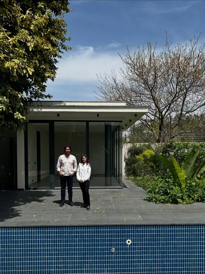 A moment of calm at the House of Passages. The minimal pool house opens directly onto the poolside patio, with large glass doors that can disappear to completely merge the indoor and outdoor spaces.