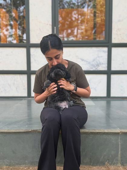 Cuddling the teeny tiniest member of our pack, baby Mango.