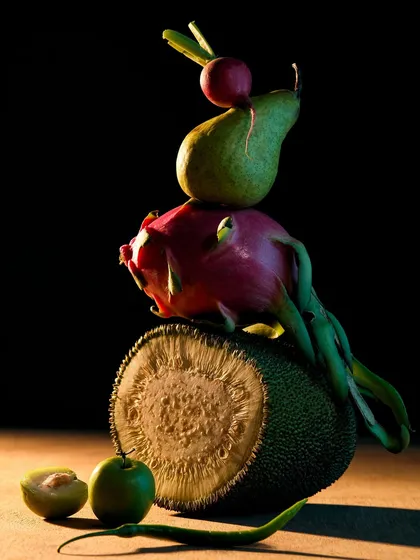 This image is from a personal series where I explored form and light using everyday fruits and vegetables. By stacking them in an unusual way and using dramatic, focused lighting, I aimed to create a piece of fine art that makes you see familiar objects differently.