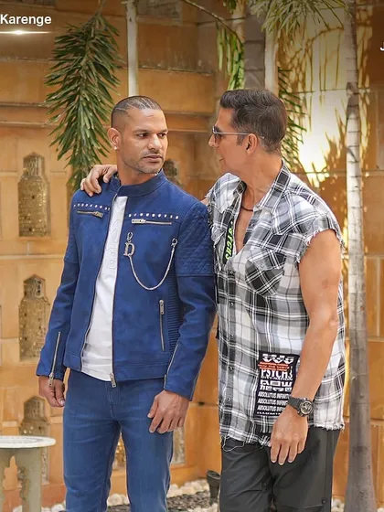 A powerful shot of Shikhar Dhawan with Akshay Kumar on 'Dhawan Karenge'. I styled Shikhar in a custom blue studded jacket to create a standout look next to Akshay's rugged style.