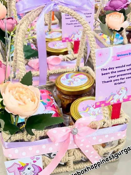 This image captures the whimsical feel of the unicorn return gifts, with their floral accents and sparkling details.