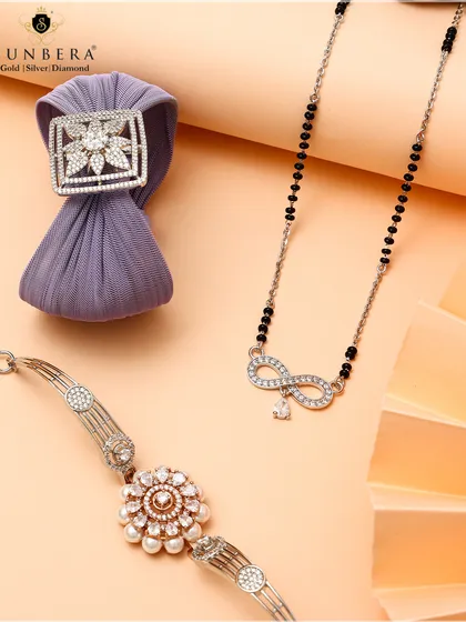This image highlights some of my best-selling silver designs. It features a silver mangalsutra with an infinity loop pendant, a floral pearl bracelet, and a square diamond-studded fabric scrunchie, perfect for gifting or personal wear.
