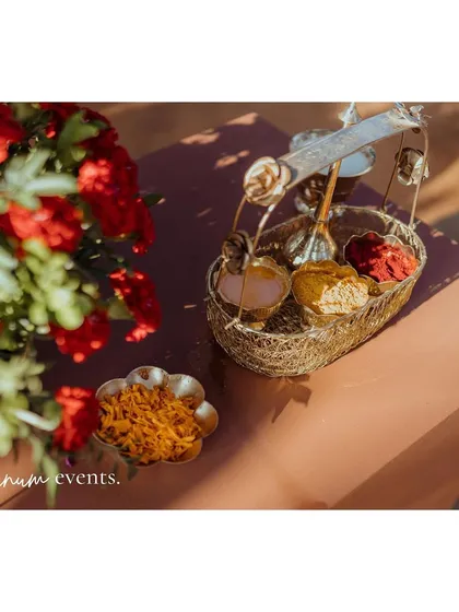 Traditional items for the ceremony, beautifully arranged with fresh flowers.