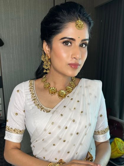 Something about this gorgeous face. For her Haldi ceremony, we created a luminous look with clean skin and defined eyes to go with her classic white and gold saree.