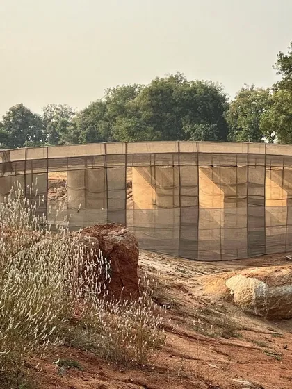 A closer view of the bridge mock-up, showing how the fabric captures the light. This process of large-scale modeling is essential for ambitious landscape interventions.