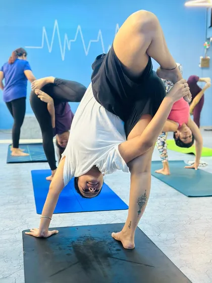 Another student showing incredible flexibility and balance. This is the result of consistent effort and a dedicated practice.