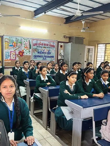 A classroom full of bright young girls attending my session on adolescent nutrition. I focus on topics like iron deficiency, energy for sports, and building a positive body image through healthy eating.