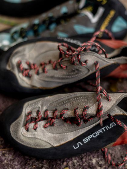 A collection of our rental climbing shoes. We have various sizes and models to ensure everyone has the right gear for their feet.