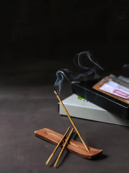 A single stick of our herbal incense burns gently, its smoke curling into the air. Incense helps you unwind, create calm in your home, and encourages you to be present and take things slow.
