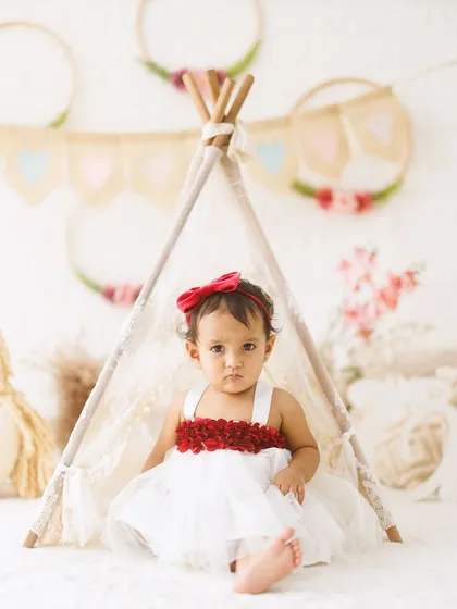A whimsical teepee setup for this little adventurer. This portrait is perfect for a sitter session or first birthday, creating a sweet and imaginative scene.