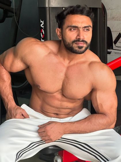 Living in my own world. A relaxed pose in the gym.